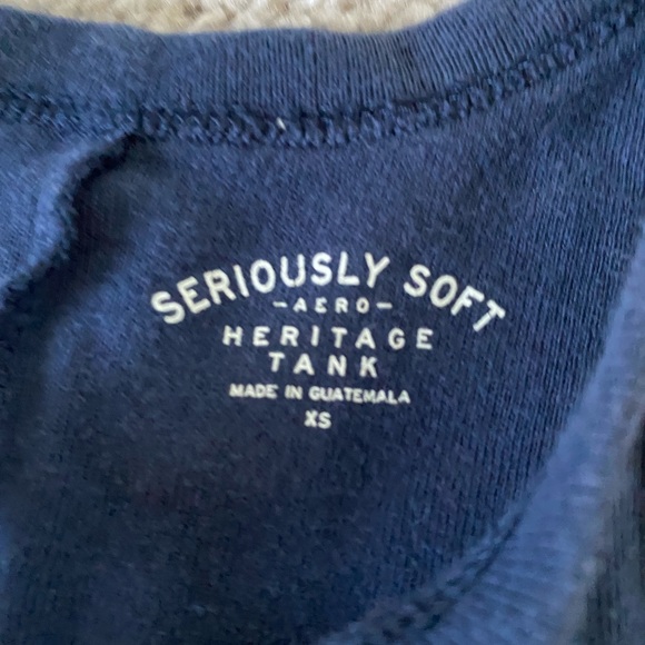 This is a navy blue tank top with red and white and pink strip design. Size XS. - Picture 3 of 3